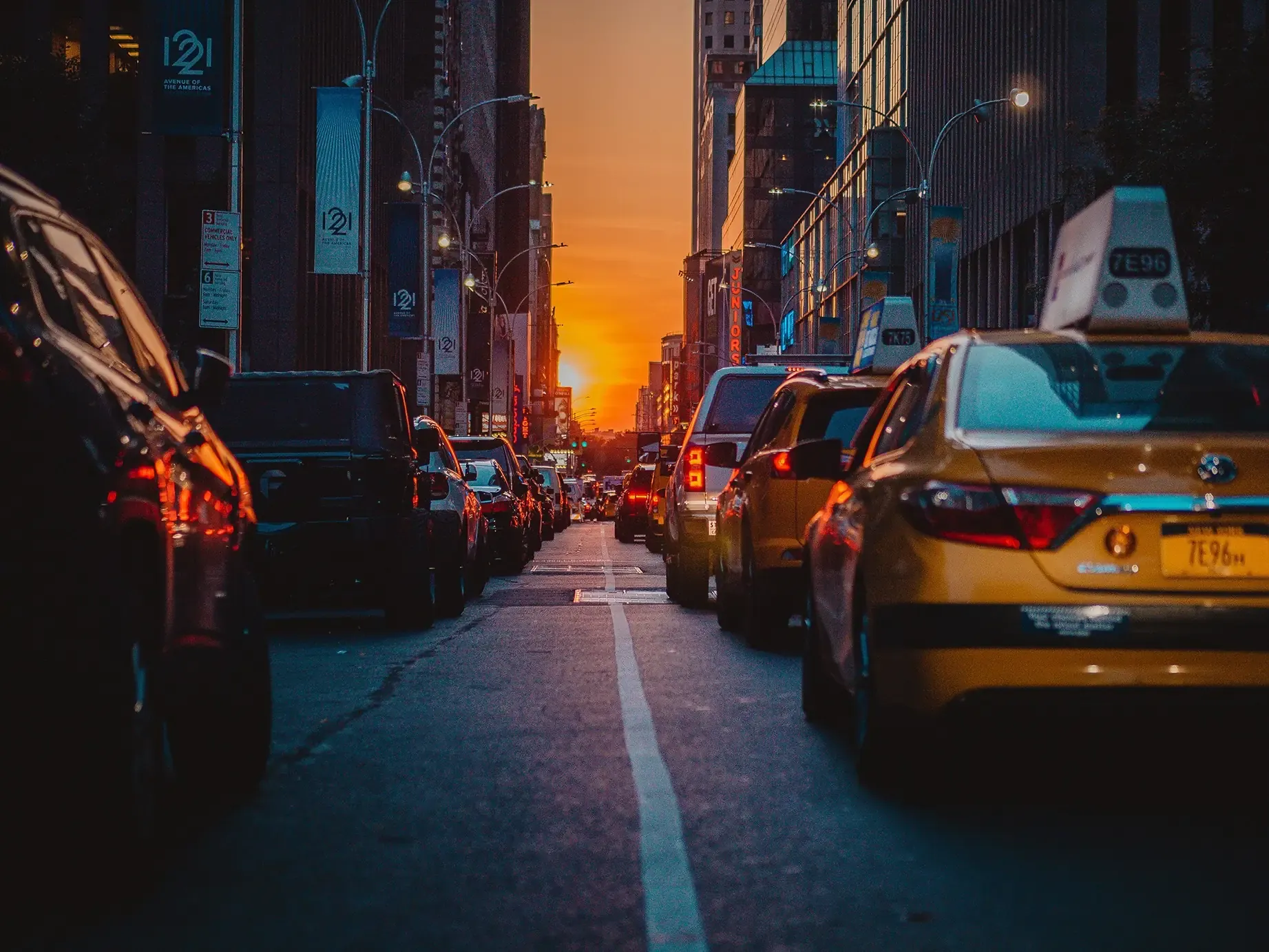 NYC taxi cab at sunset on a busy Manhattan street